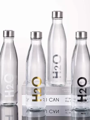 Botella de vidrio "H2O" Dorada.